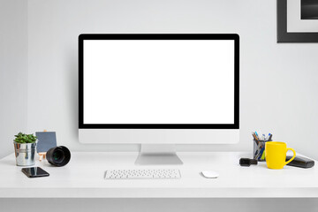 Wall Mural - Computer display mockup on office desk with isolated screen for web site design or product presentation