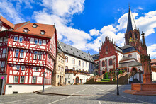 Aschaffenburg, Germany,  Town Suqre With Catholic Curch  'Kollegiatsstift St. Peter Und Alexander' Or 'Stiftskirche' And Half Timbered Building In Historic City Center 