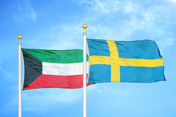 Kuwait and Sweden two flags on flagpoles and blue sky