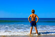 © M.studio - boy, foot on the sea- beautiful beach