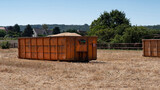 Fototapeta Paryż - Transport bucket for cereal grains harvested in a field