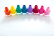© Inga - Colorful nail polish bottles on white background, copy space