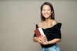 © muse studio - smiling beautiful student girl with a large book in her hands