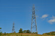 High-power electricity generators in Dumbarton. High voltage electric transmission towers.