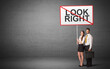 © ra2 studio - business person holding a traffic sign with LOOK RIGHT inscription, new idea concept