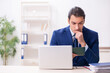 © Elnur - Young man checking passport in the office