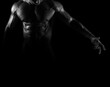 © sameer - Silhouette of young athlete bodybuilder man on black