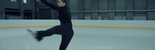 Professional Female Ice Figure Skater Practicing Spin On Indoor Skating Rink Shot On RED Cinema Camera With 2x Anamorphic Lens, 75 FPS Slow Motion
