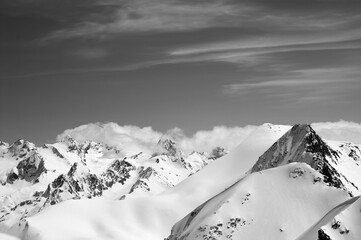 Winter mountains with snow cornice and sky with clouds in nice cold day