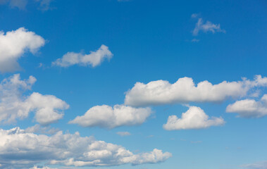 Wall Mural - Gray clouds on blue sky background.