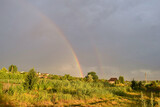 Fototapeta Tęcza - Rainbow after the end of the rain in the suburbs.