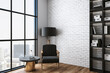 © Who is Danny - Cozy living room with chair, table, shelf with book and city view.
