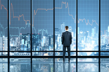 Wall Mural - Businessman standing in office interior with glowing forex chart hologram.