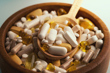 Wall Mural - Medicine pills, tablets and different drugs in wooden bowl with spoon.