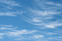 Beautiful Wispy Cirrus Clouds In Blue Sky On Freedom, Energize And Joyful Sunny Day