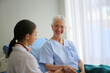 © FotoArtist - doctor talking to senior patient
