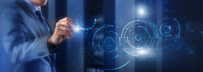 Wall Mural - man draws gears on virtual screen. blurred abstract engine room.