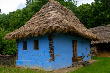 Wall Mural - traditional house made of straw and clay in the mountain village