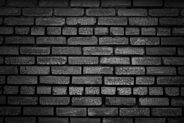 Black brick wall texture background. Black white grunge background. Old brick wall with cracks.