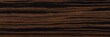 Unique ebony veneer background in dark color. Natural wood texture, pattern of a long veneer sheet, plank.