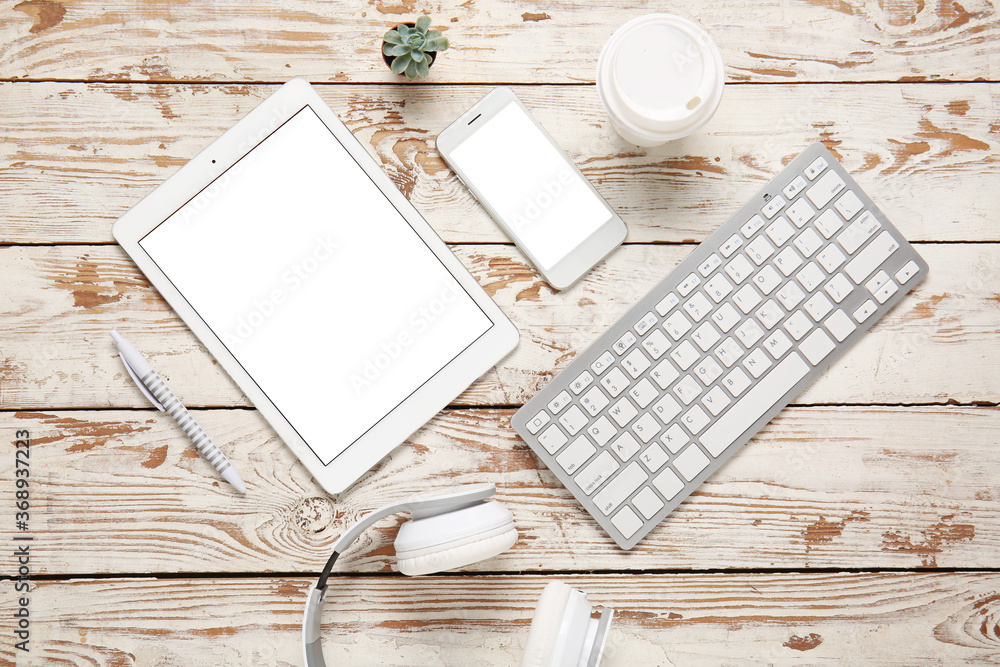 Composition with modern tablet computer on wooden background