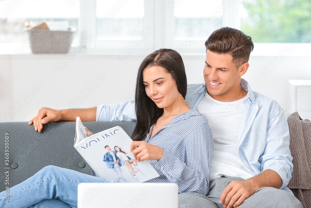 Young couple relaxing on sofa at home