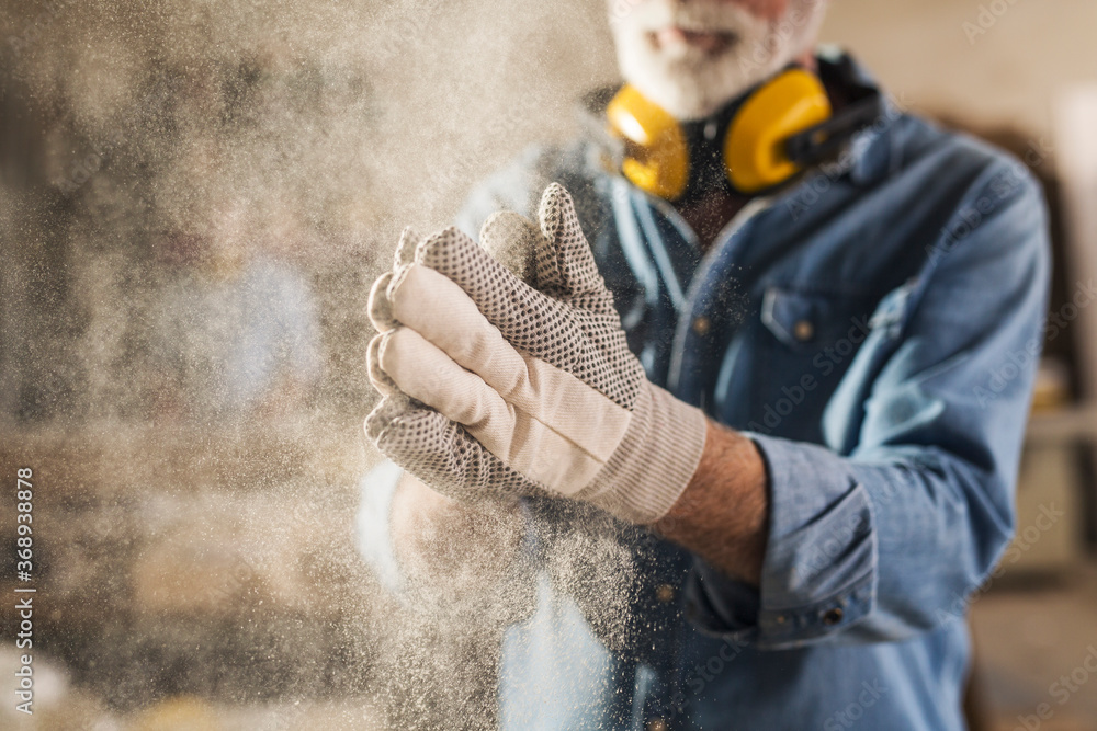 Carpenter cleaning work gloves - obrazy, fototapety, plakaty 