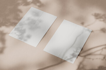 Blank vertical sheets of A4 paper on a light beige background with shadows. Side view. Mock up. 3d rendering