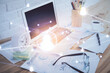 © peshkova - Computer on desktop with social network hologram. Double exposure. Concept of international people connections.