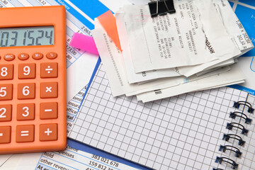 business office desk closeup - financial reports, analysis and accounting, set of documents, tables and graphs, various items for bookkeeping, calculator