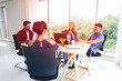 © torsakh - Group of business people or creative designer talking and meeting or discussion in conference room, team brainstorming new marketing project, colleagues teamwork working together