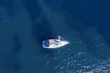 Fototapeta  - Aerial view of sailing yacht in the sea