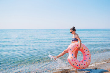 Poster - Young woman in hat on the beach vacation