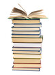 © nndanko - stack of various books, on top an open book, items are isolated on white background