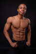 © Ranta Images - Portrait of young handsome muscular African man shirtless