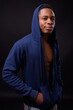 © Ranta Images - Young handsome African man against black background