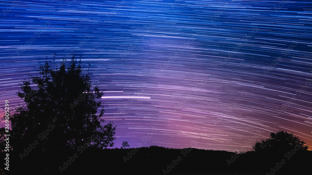 Beautiful star trail image during the night. - obrazy, fototapety, plakaty 