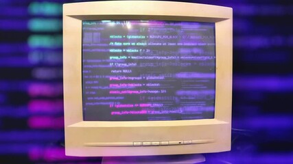 Hacking a vintage old vintage TV or computer monitor screen 80s 90s style. Glitches on screen monitor. Abstract source code data flow. Purple and blue text. screen noise. VHS style. Old kinescope