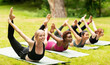 © Prostock-studio - Happy diverse girls doing bow yoga pose on outdoor yoga practice in nature