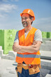 © Svitlana - Merry mature bearded Caucasian builder standing outdoors