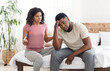 © Prostock-studio - Black girl with pregnancy test yelling at her upset boyfriend