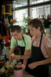 © slavomir pancevac - young people work in the flower shop