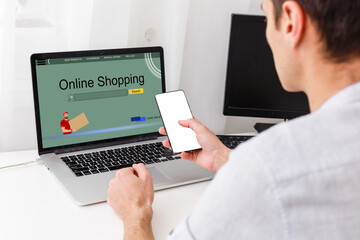 Businessman Using Laptop With Online Shopping Application On A Screen