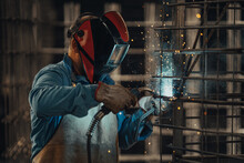 Experienced Welder Works In The Factory