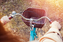 Close Up Of Female Hands On Vintage Bicycle Steering Wheel, Top View