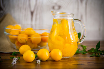 Poster - sweet cooked compote in a glass decanter of ripe yellow cherry plum