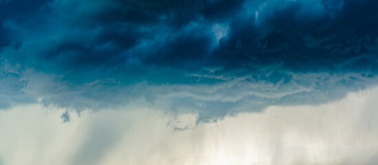 Dramatic stormy clouds, close up view on a fluffy cumulus before storm.