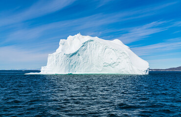 Wall Mural - climate change. iceberg afrom glacier in arctic nature landscape on greenland. icebergs in ilulissat