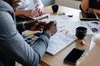 © Milles Studio/Stocksy - Multiethnic coworkers brainstorming project in conference room