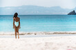 © David Prado/Stocksy - Beautiful woman in a tropical beach island